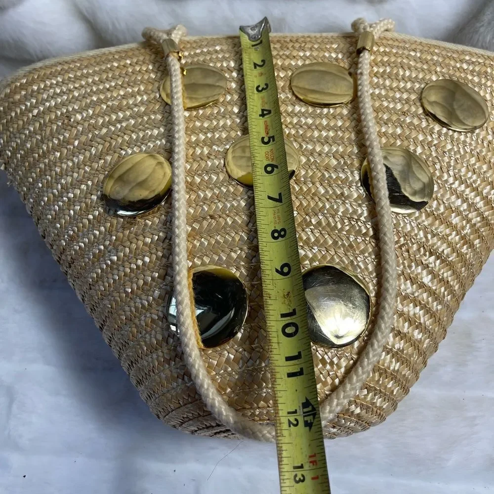 Natural straw bucket style tote bag with rope straps with gold tone acce…